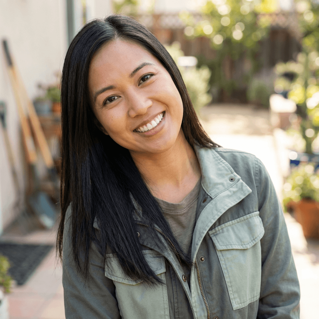 Female health advocate in early 40s, East Asian, confident and determined appearance